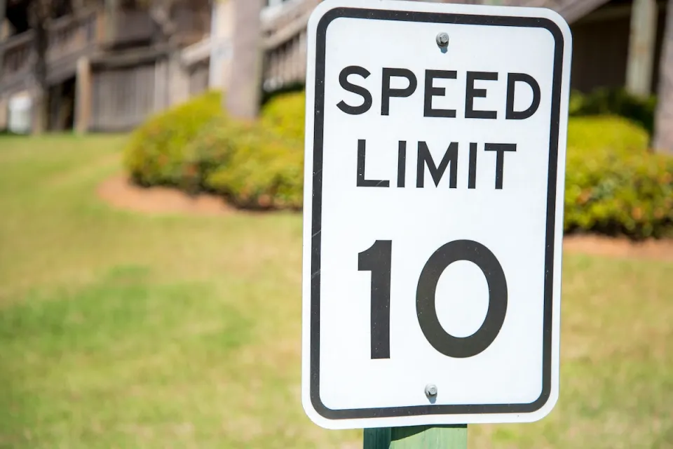 Close-up of 10 mph speed limit sign.
